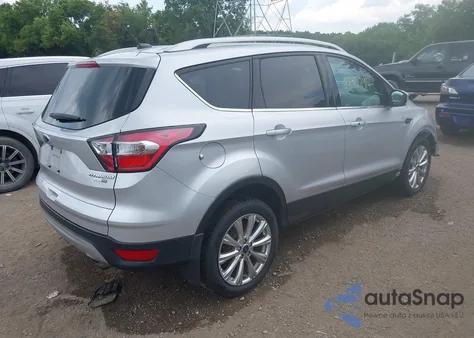 2017 Ford Escape Titanium z USA, uszkodzony, nr VIN 1FMCU9J93HUA68117